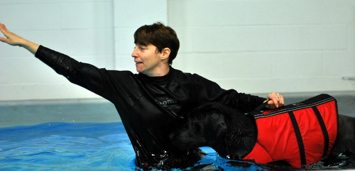 Carrie encouraging the black lab